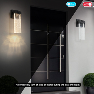 Modern black outdoor sconce night view